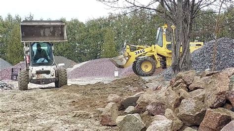 moving boulders with skid steer|Bobcat S250 Skid Steer Moving Large Rocks .